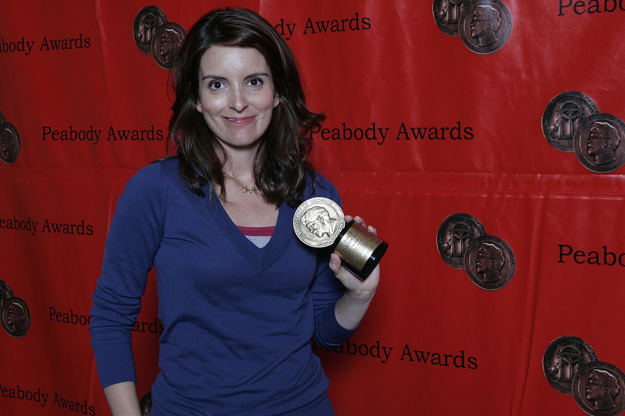 Tina Fey posing with award