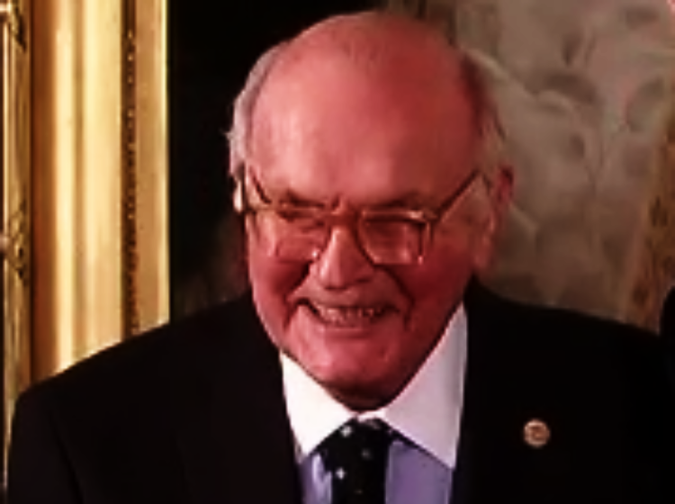 Harry Wesley Coover Jr wearing a suit