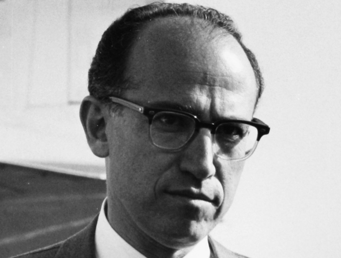 Dr Jonas Edward Salk wearing a pair of glasses