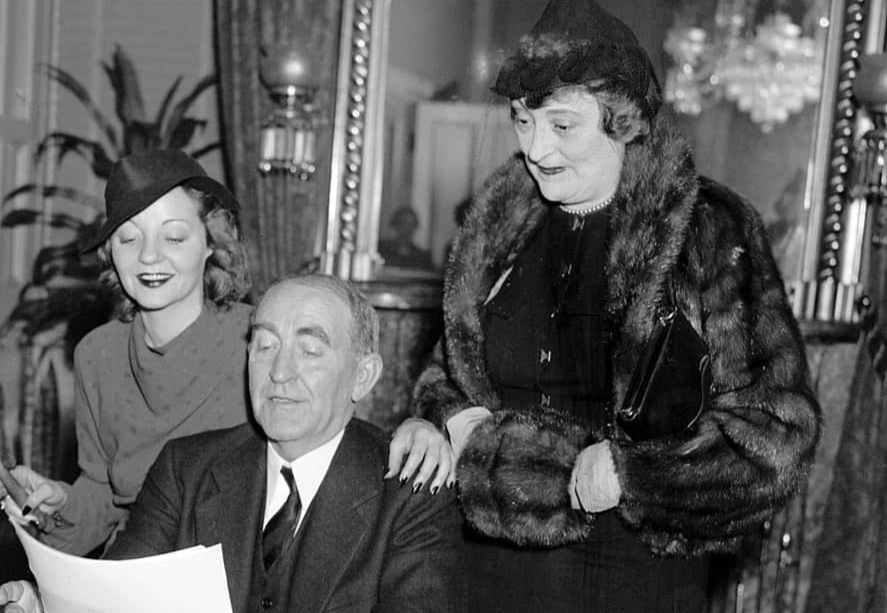 Photograph of Tallulah Bankhead with her father and stepmother in her father's office