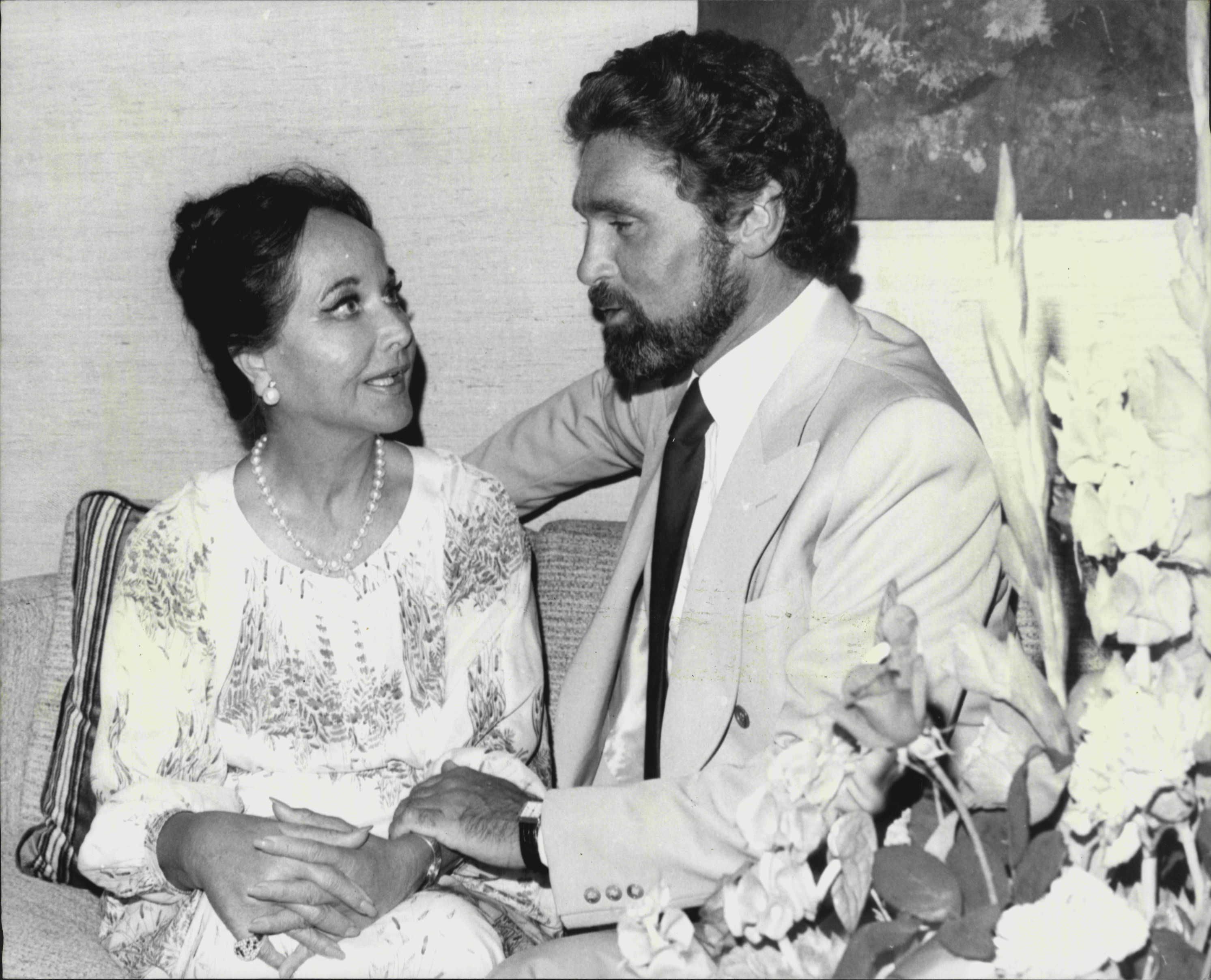 US Film star Merle Oberon of Hollywood photographed with husband Robert Wolders in their's Hilton Hotel residence.