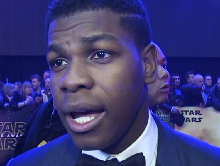 John Boyega wearing a suit at Star Wars European premiere
