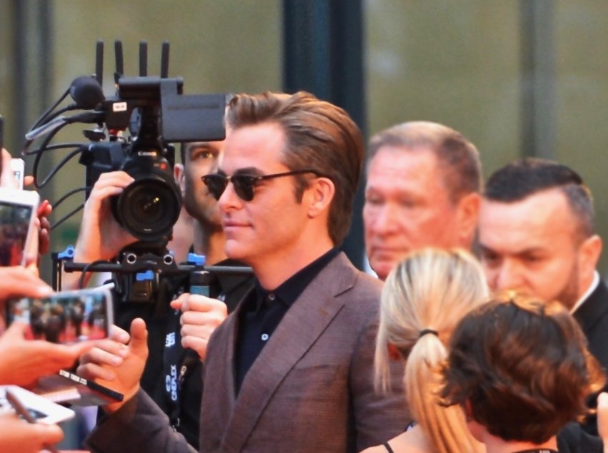 Chris Pine wearing a grey suit