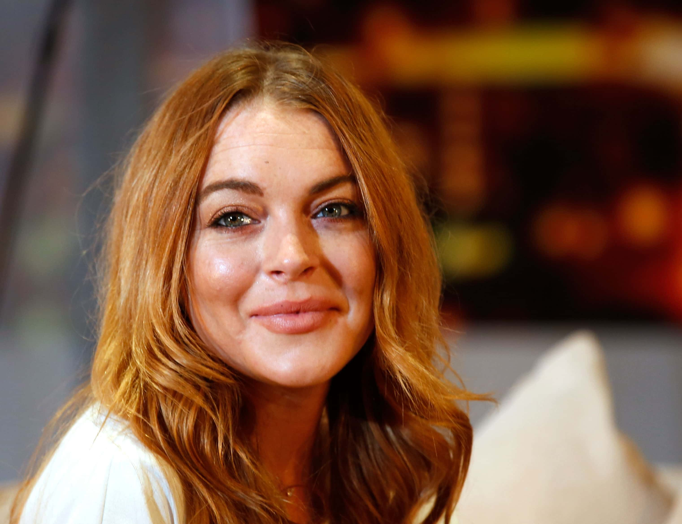 Lindsay Lohan performs during a photocall