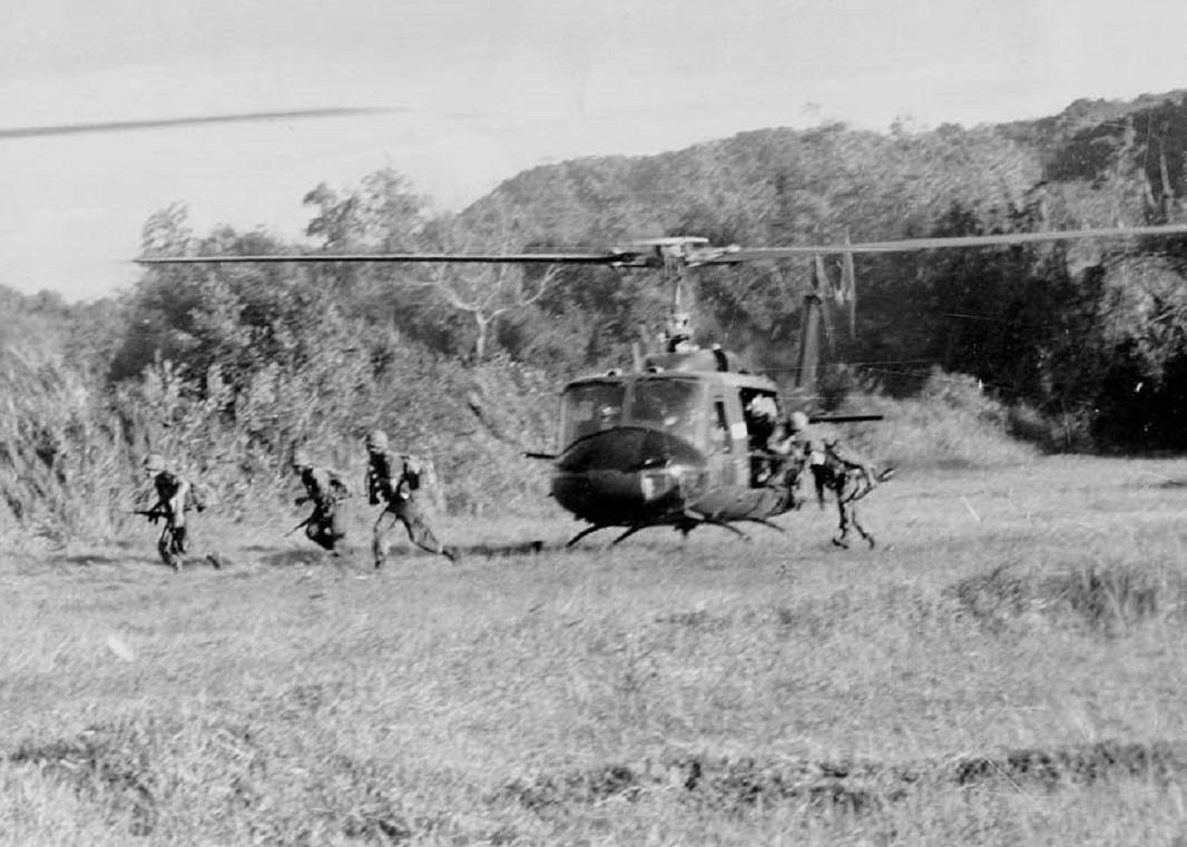 Soldiers of the U.S. Army  disembark from a Bell UH-1D - 1965