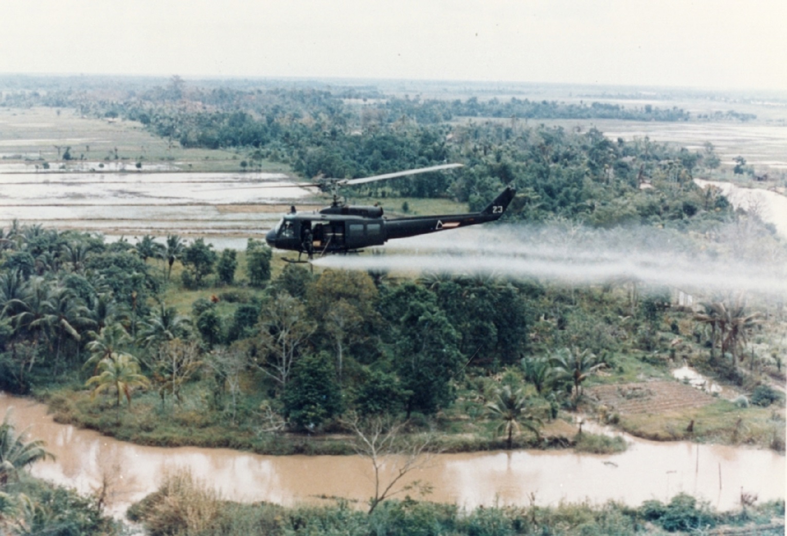 A military helicopter spraying Agent Orange during the Vietnam War - 1963