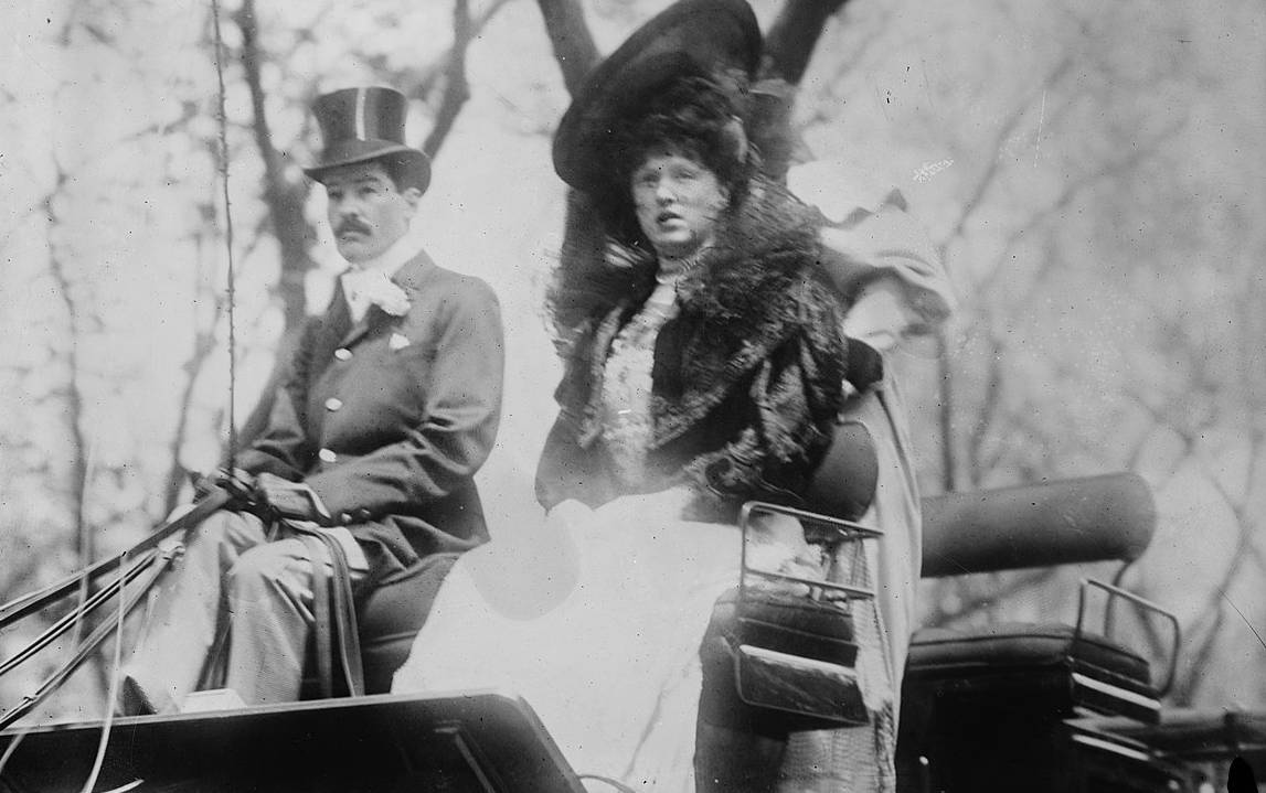 Alfred Gwynne Vanderbilt in suit and hat together with former wife