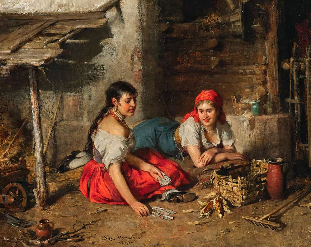 Two woman playing cards