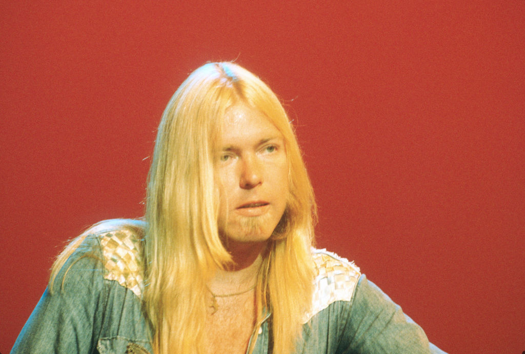 Gregg Allman in blue shirt