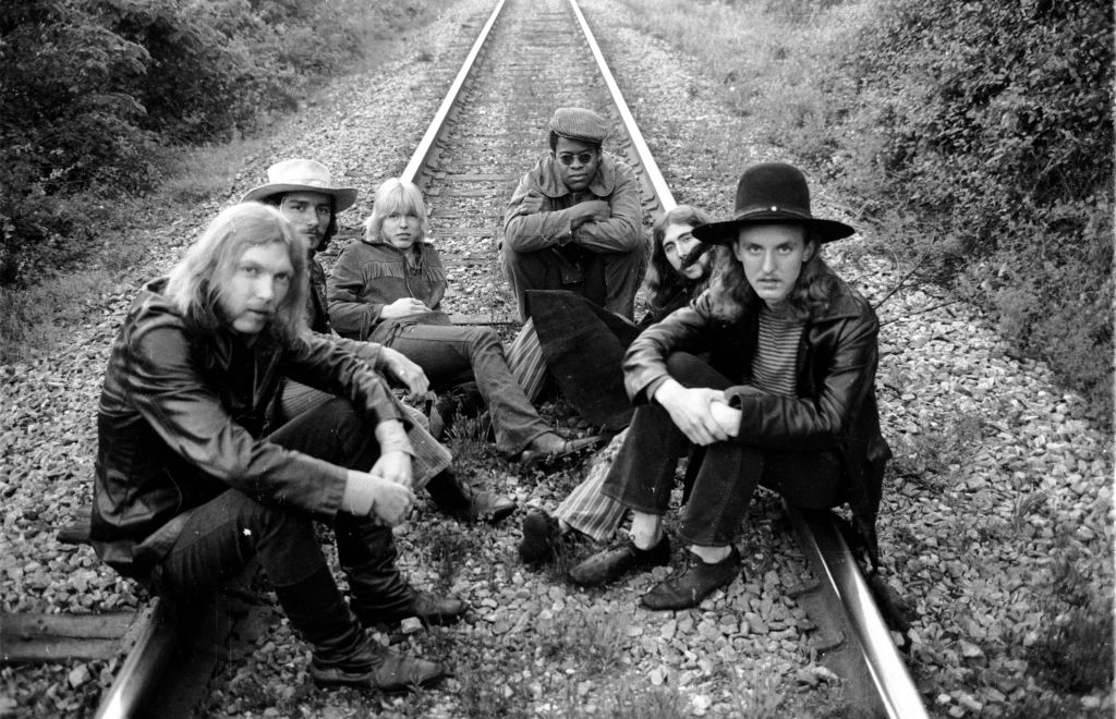 Rock group The Allman Brothers  on some rairoad tracks