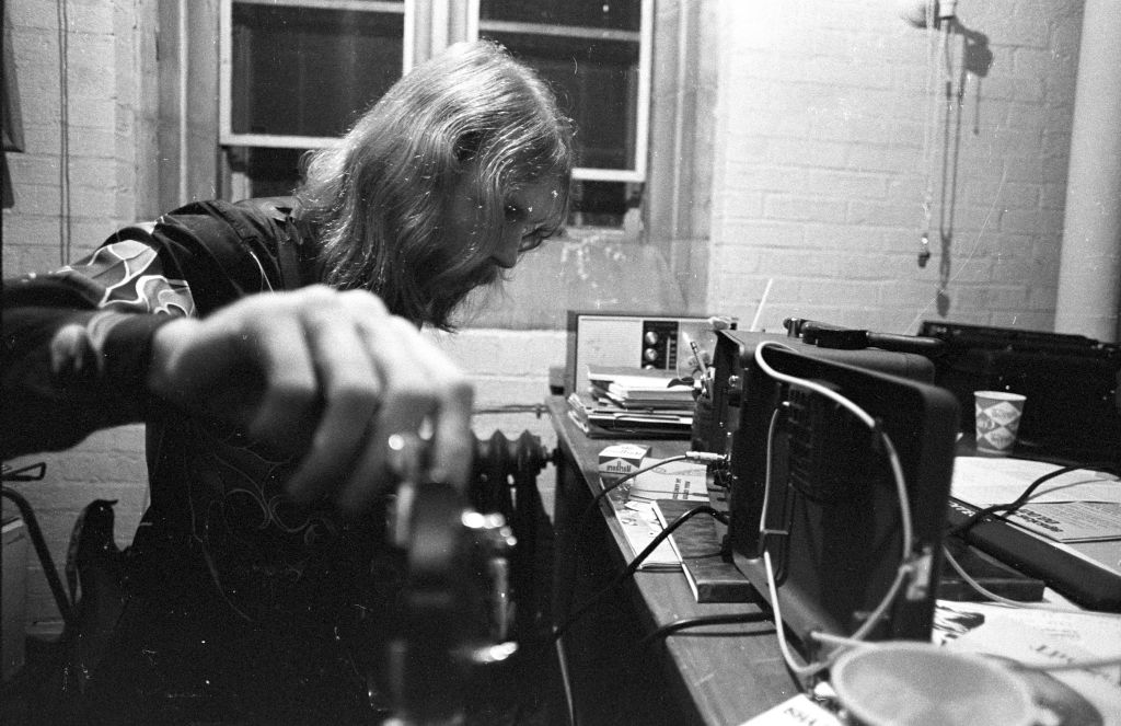 Duane Allman tunes up backstage