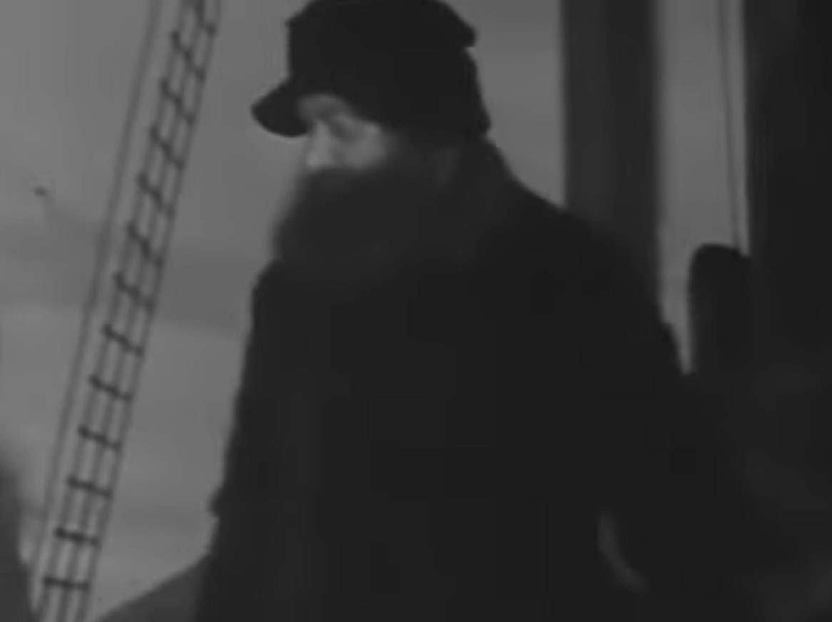 Screenshot of Peter Freuchen looking at side in black clothes - from Eskimo (1933)
