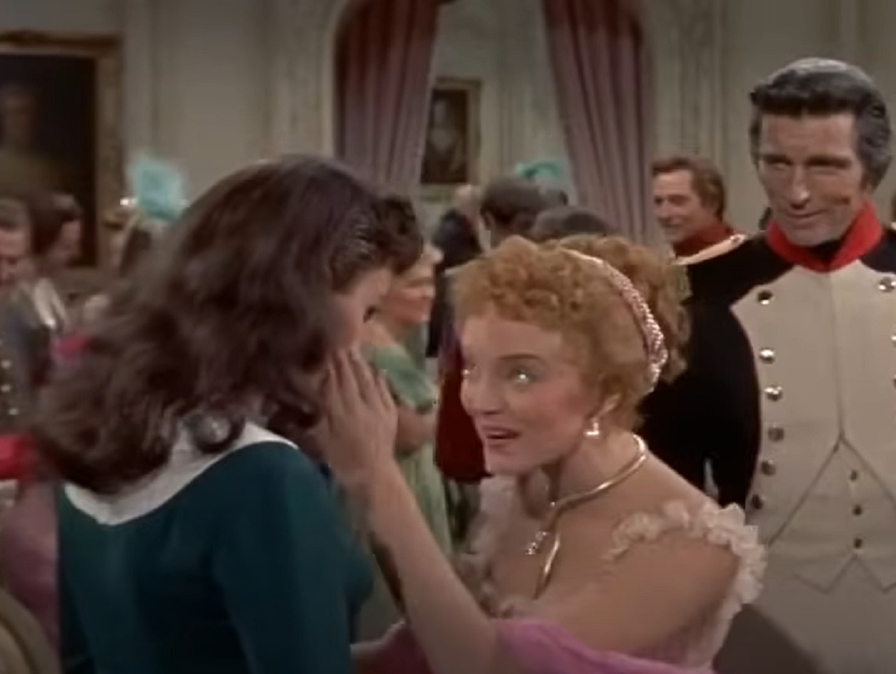 Screenshot of Madame Tallien talking with a man - from Désirée (1954)