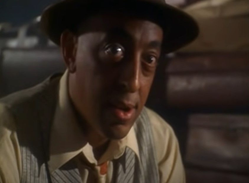 Gregory Hines as Bill Robinson in suit