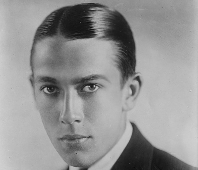 Grayscale Portrait Photo of the actor Jack Pickford wearing black suit
