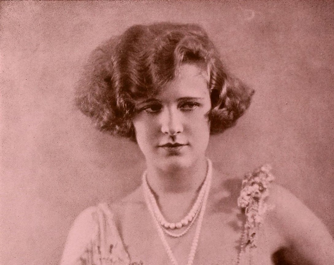 Grayscale Portrait Photo of the actress Actress Marilyn Miller wearing a white dress