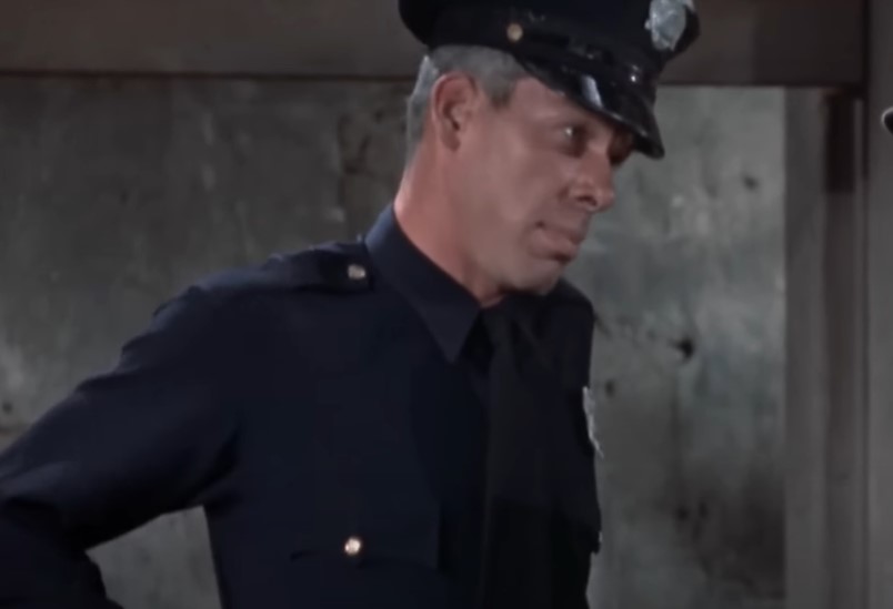 lee marvin in Gorilla at Large wearing security or police officer uniform