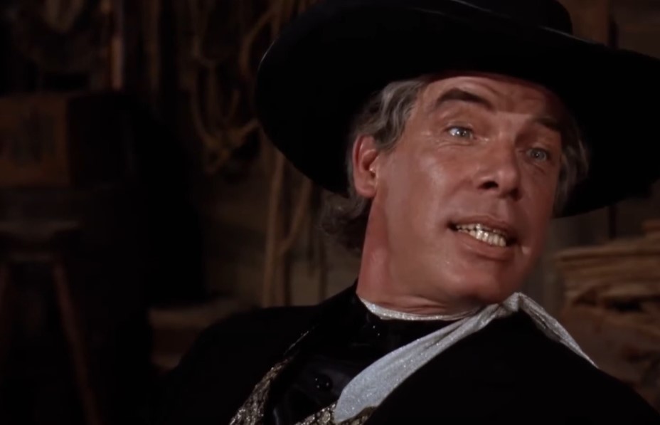 Lee Marvin in Cat Ballou wearing black western clothes and hat