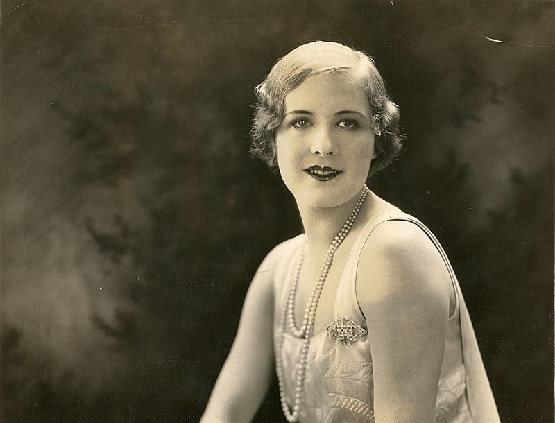 Grayscale Portrait Photo of the actress Marilyn Miller wearing white dress