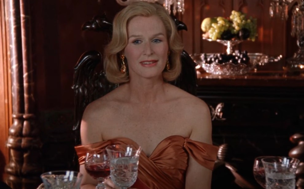 Glenn Close as  Sunny von Bulow in  the movie wearing orange dress