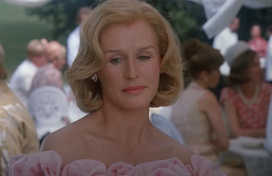 Glenn Close as  Sunny von Bulow in  the movie wearing pink dress at wedding