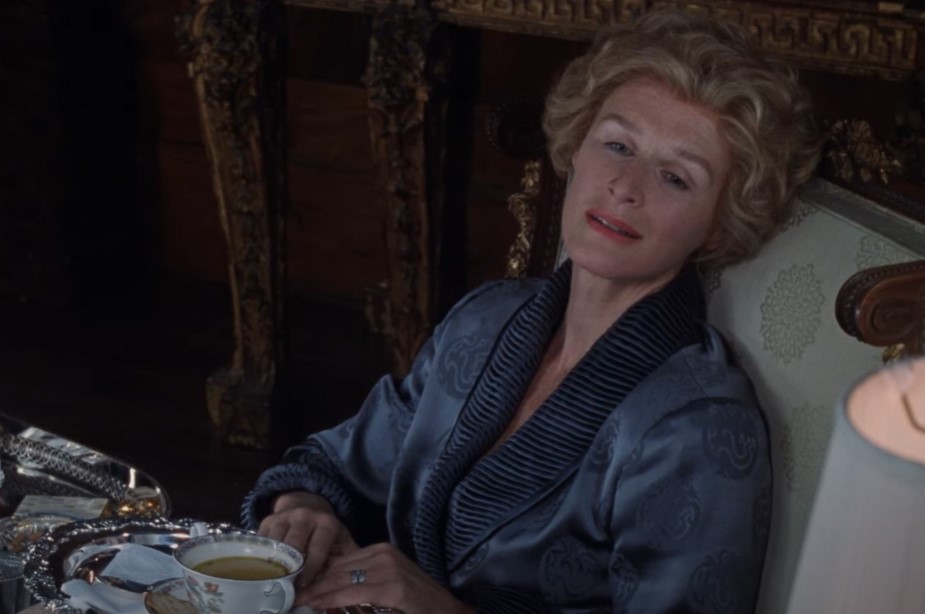 Glenn Close as  Sunny von Bulow in  the movie wearing gray bathrobe