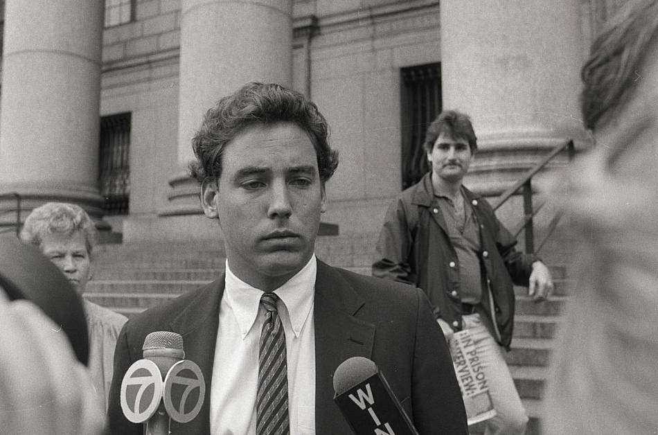 Alexander Von Auersperg in suit speaking to a Journalists