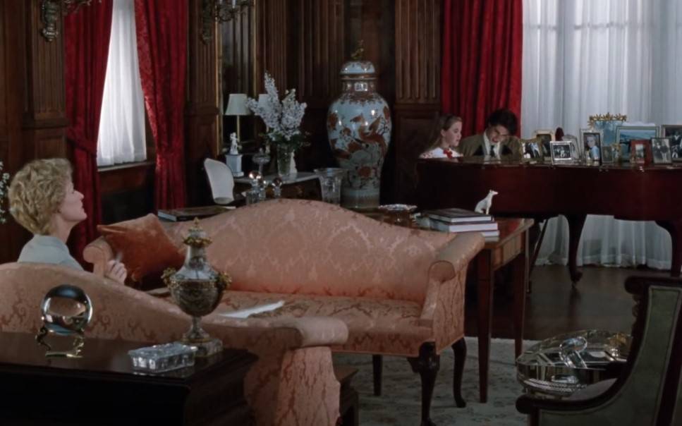 Glenn Close as  Sunny von Bulow in  the movie sitting on a couch