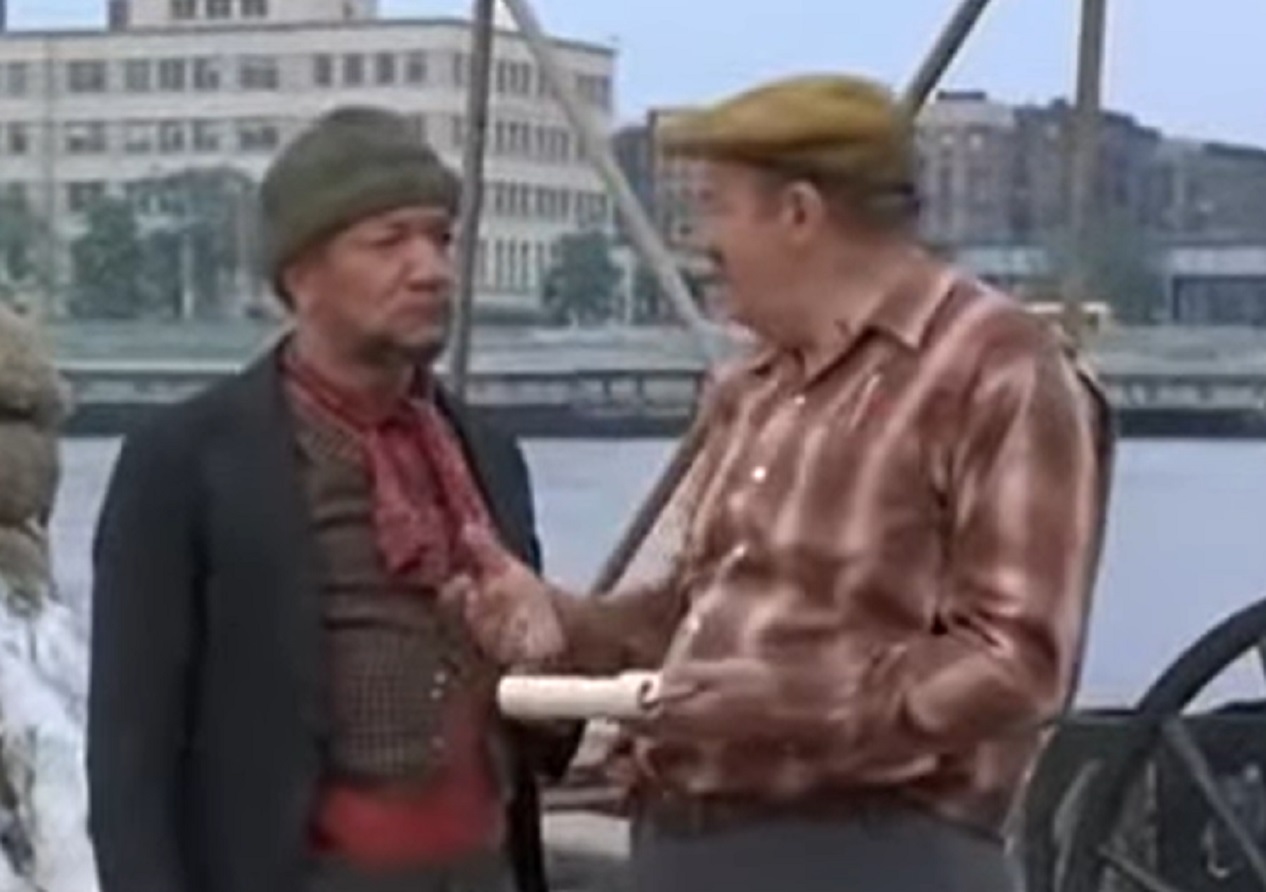 Screenshot of Redd Foxx talking with other man -  from Cotton Comes To Harlem (1970)