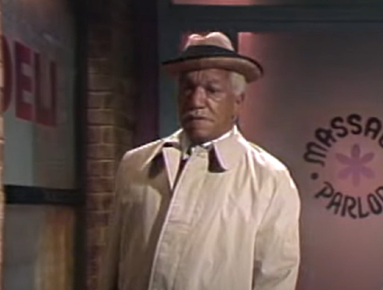 Screenshot of Redd Foxx wearing white coat and hat ,looking sad - from The Redd Foxx Show (1986)