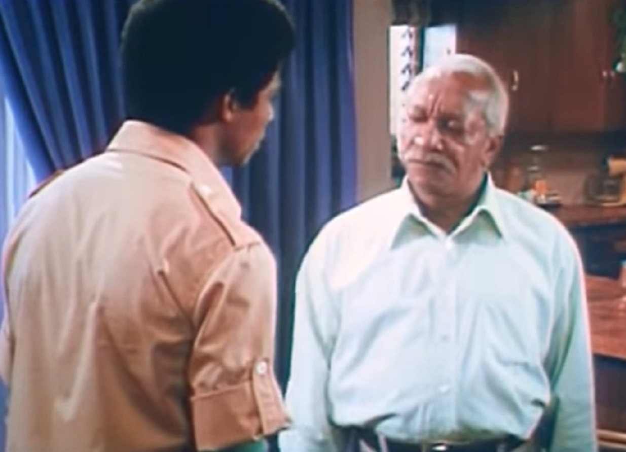 Screenshot of Redd Foxx talking with other man  - from Norman ... Is That You (1976)