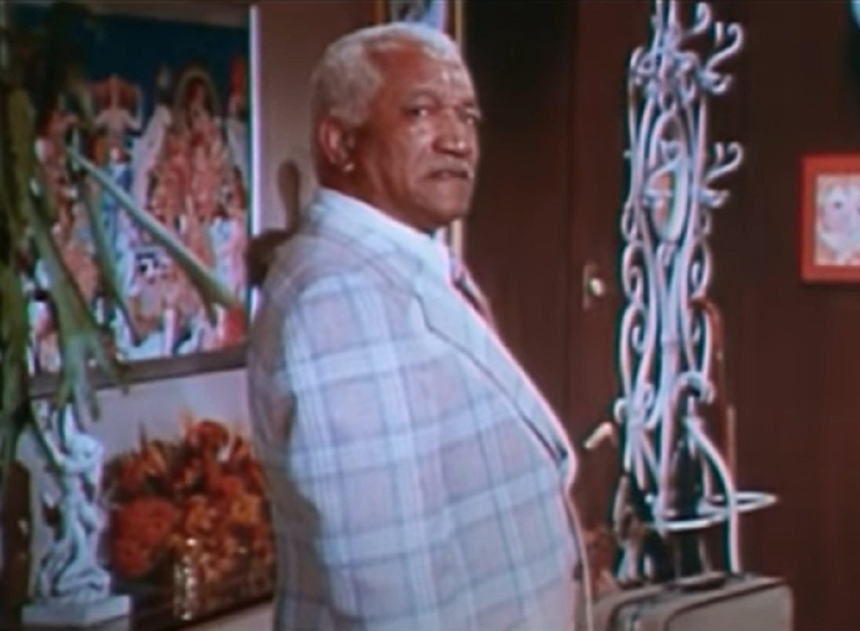 Screenshot of Redd Foxx in light suit looking at side - from Norman... Is That You? (1976)
