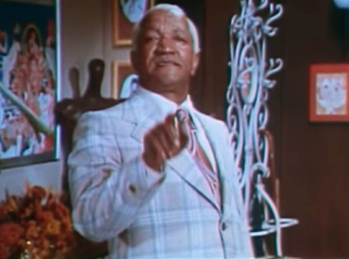 Screenshot of Redd Foxx in white suit is looking at camera - from Norman... Is That You? (1976)