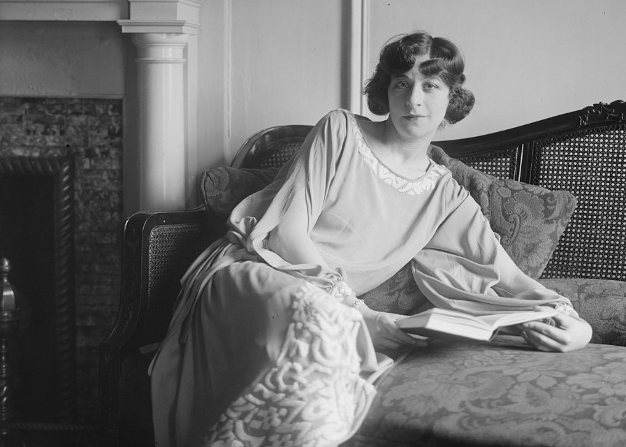 Fanny Brice sitting on a couch