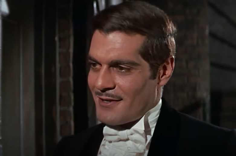 Omar Sharif  as Nick Arnstein in suit