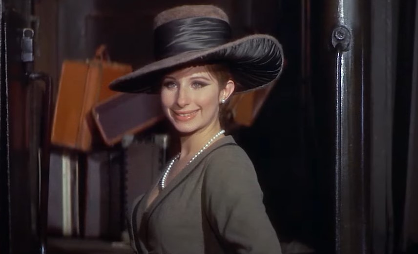 Barbra Streisand  as Fanny Brice in coat and gray hat