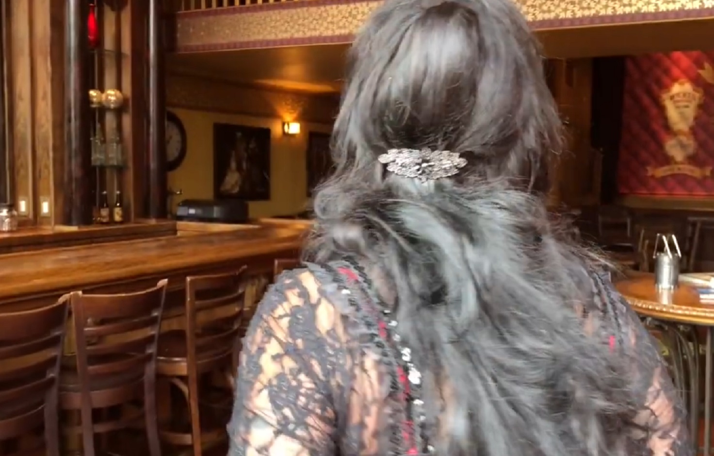 Screenshot of Big Nose Kate (Kate Horony) walking at bar - from One Day Only (2018/19)