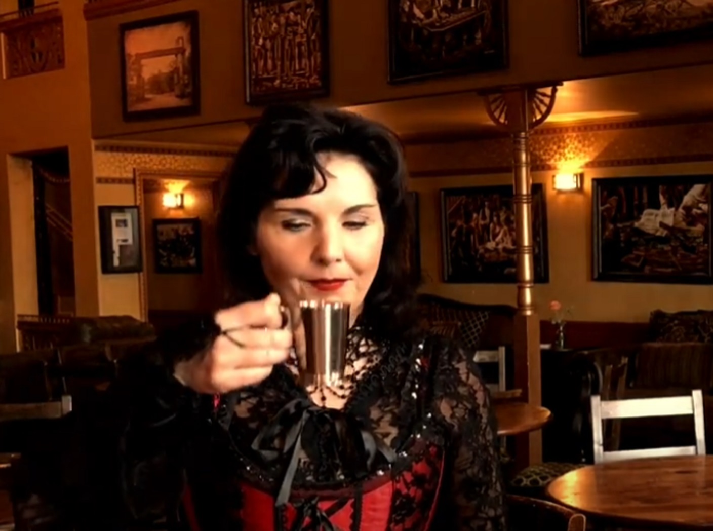 Screenshot of Big Nose Kate (Kate Horony) drinking at saloon- from One Day Only (2018/19)