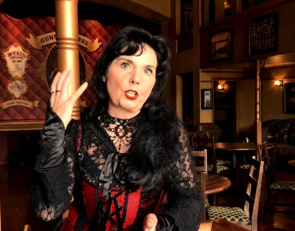 Screenshot of Big Nose Kate (Kate Horony) looking at front and talking - from One Day Only (2018/19)