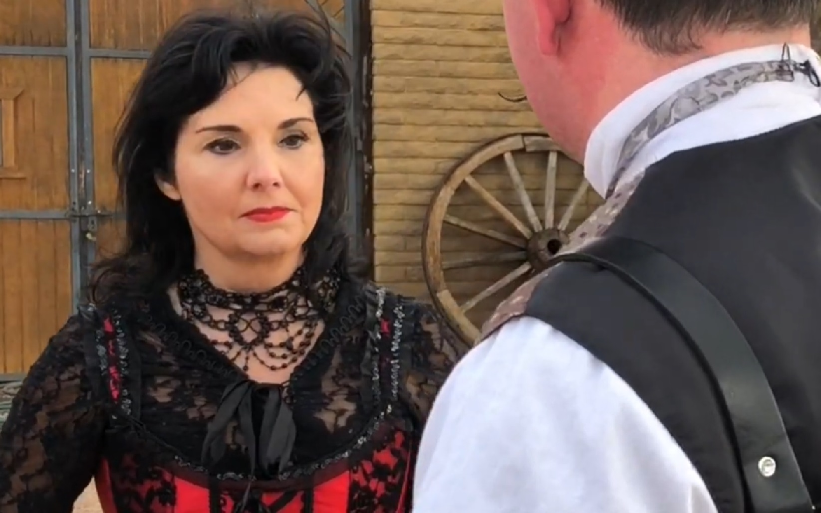 Screenshot of Big Nose Kate (Kate Horony) talking with man outside - from One Day Only (2018/19)