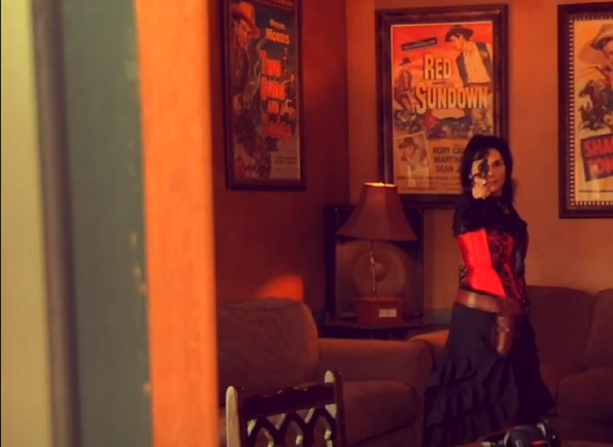 Screenshot of Big Nose Kate (Kate Horony) holding a gun - from One Day Only (2018/19)