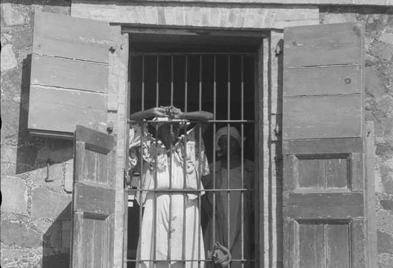 Person standing in a window. An inmate of the insane asylum - 1941