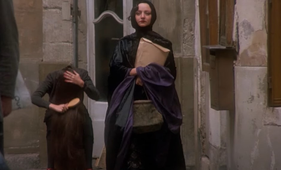 Maria de Medeiros as Anaïs Nin in scarf