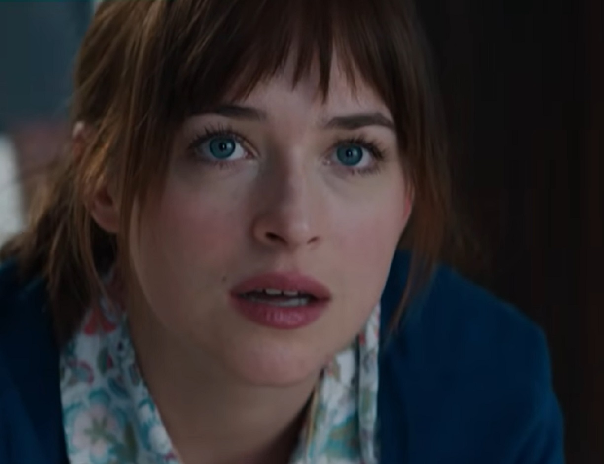 Screenshot of  Anastasia Steele looking at front - from Fifty Shades of Grey (2015)