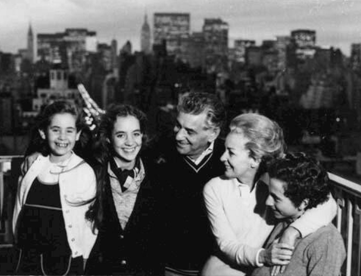 Bernstein with Felicia, Jamie, Alexander, and Nina on rooftop with New York skyline. - (1950 -1980)