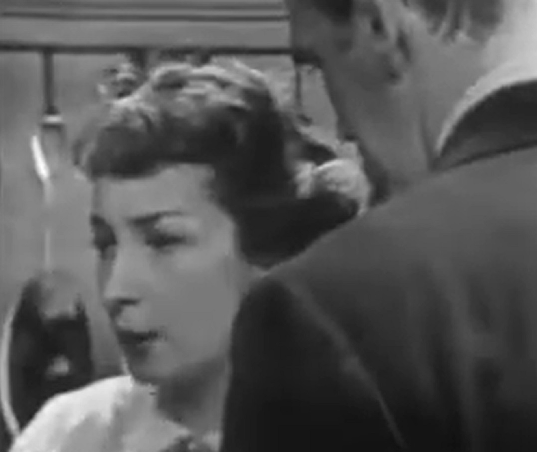 Screenshot of Felicia Montealegre looking at side - from Studio One - Flowers From A Stranger  (1949)