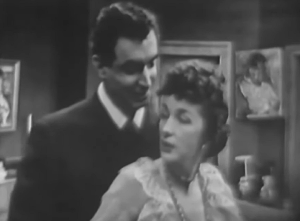 Screenshot of Felicia Montealegre talking with a man - from Studio One - Of Human Bondage  (1949)