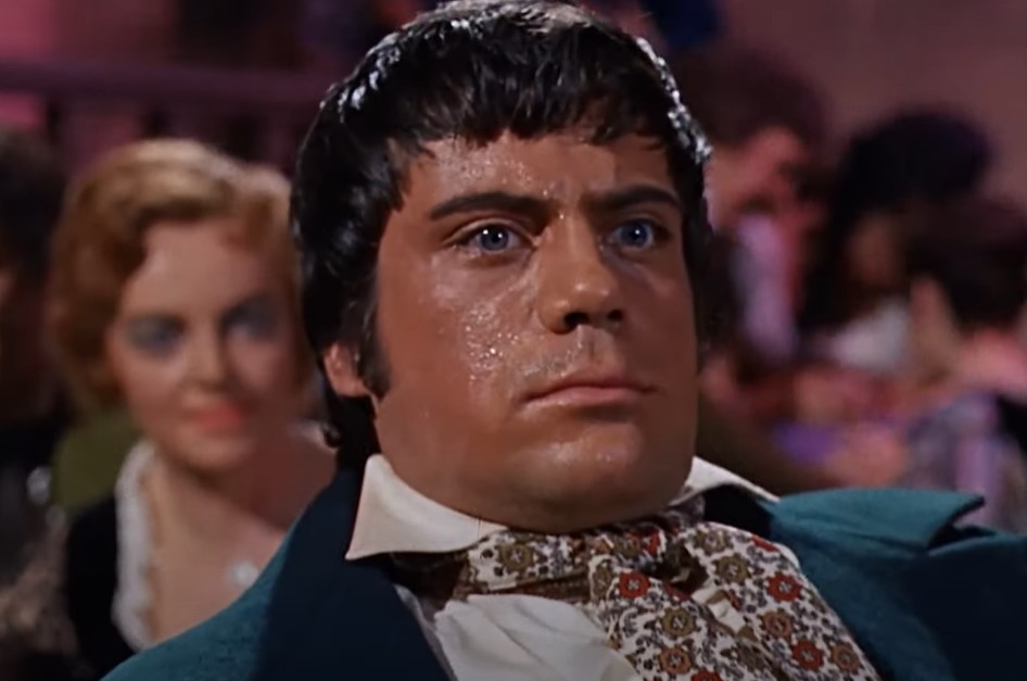 Oliver Reed in The Curse of the Werewolf in green jacket