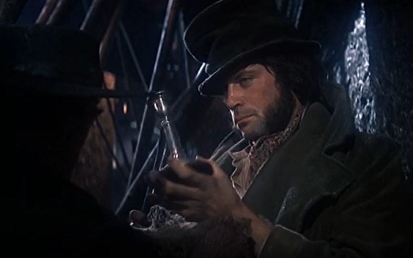 oliver reed  in Oliver! looking at front in brown jacket