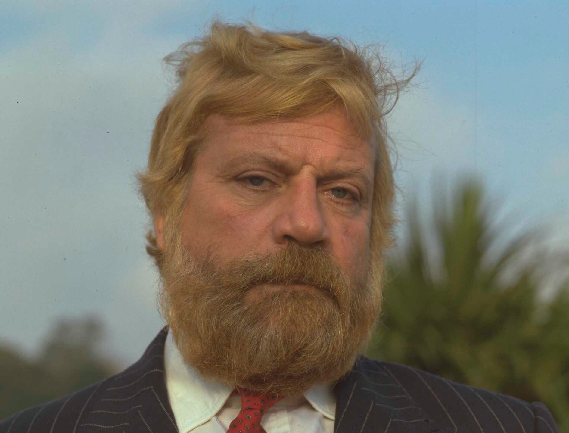 Actor Oliver Reed, circa 1987 in stripped suit